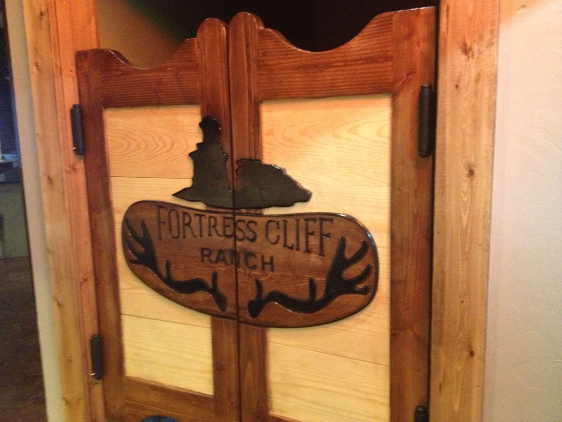 Custom Saloon Doors that say fortress cliff ranch